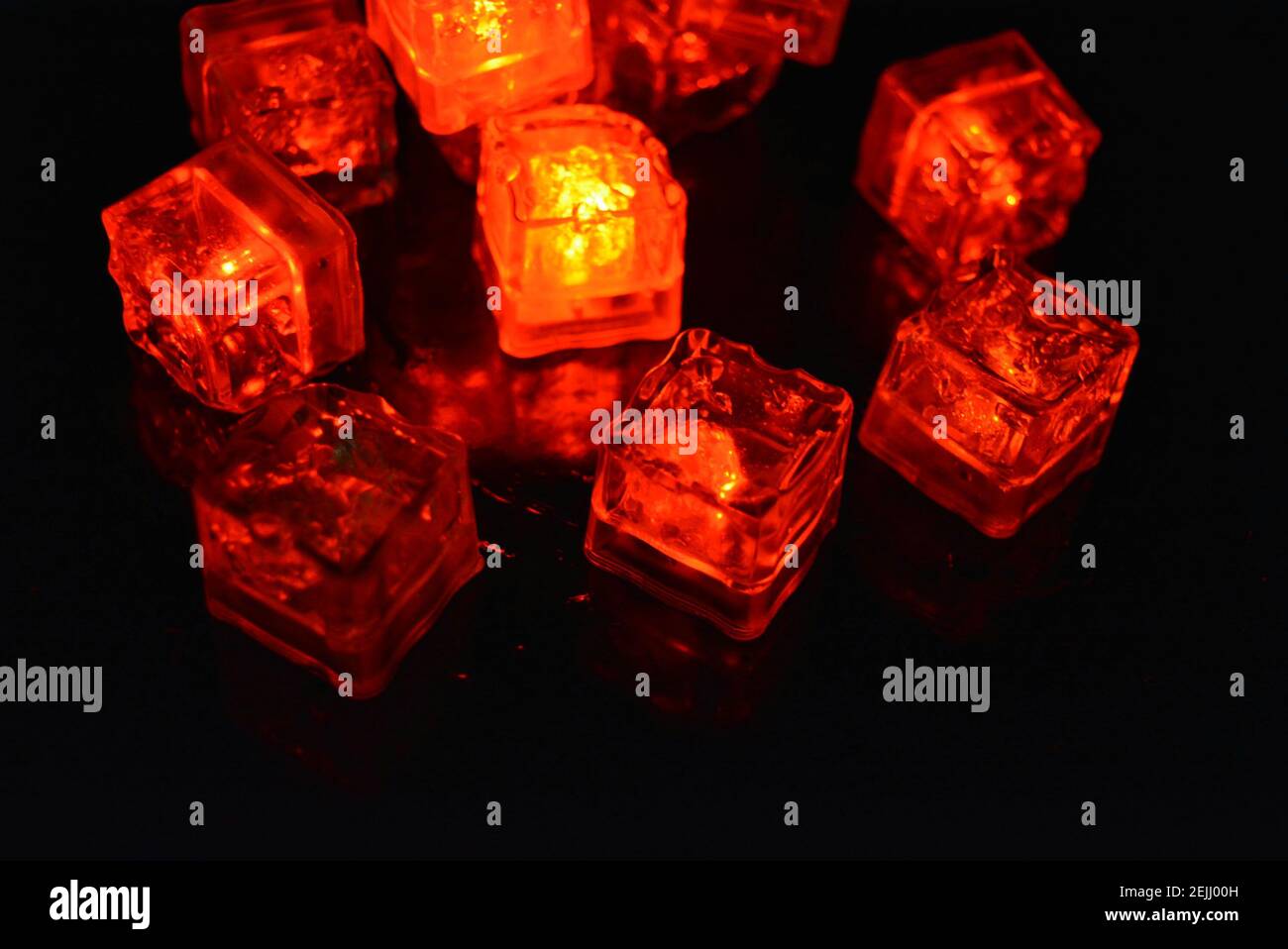 Very bright and not ordinary background of red glowing ice cubes ...