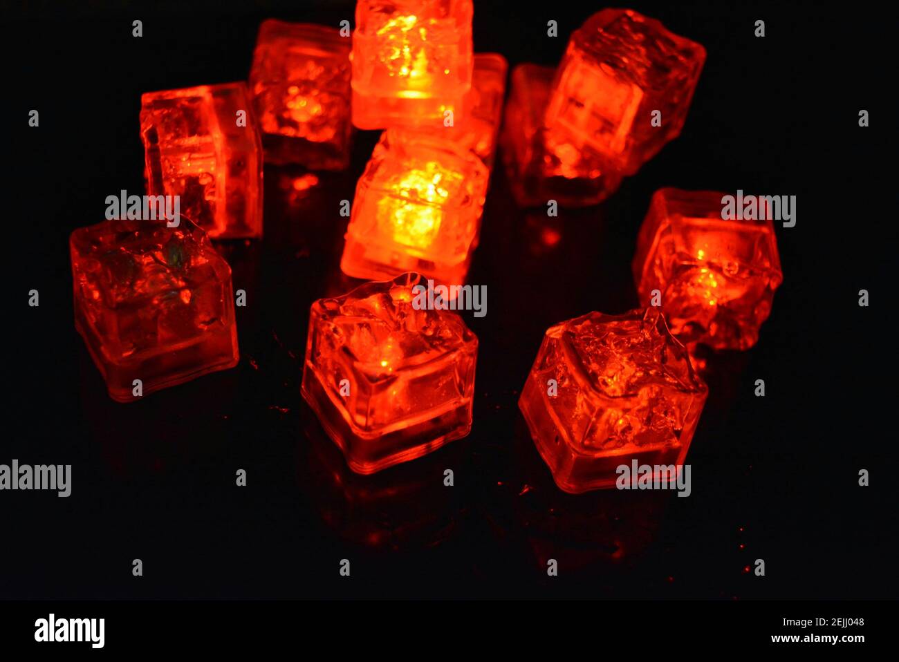 Very bright and not ordinary background of red glowing ice cubes ...