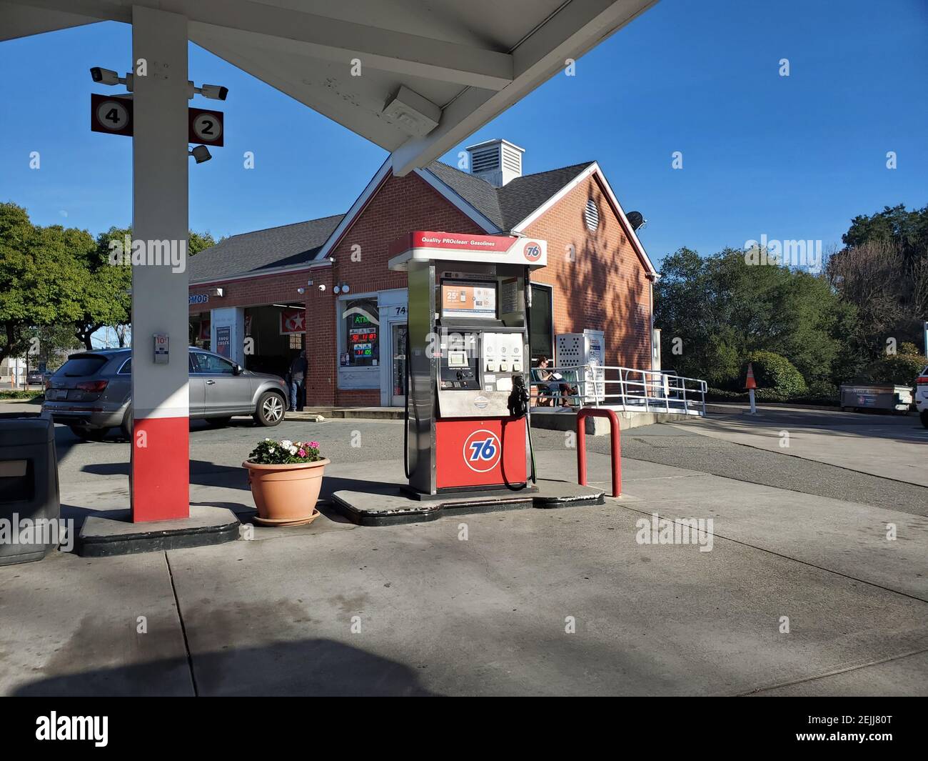 Gas pump with logo at 76 gas station, a brand of parent company