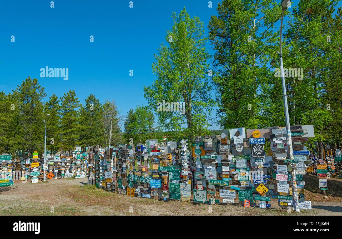 Canada, Yukon, Watson Lake, Sign Post Forest, started in 1942 by a soldier serving in the area, now numbering 80,000+ Stock Photo