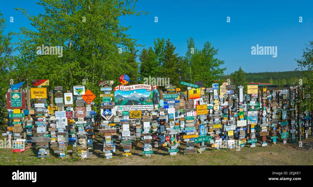 Canada, Yukon, Watson Lake, Sign Post Forest, started in 1942 by a soldier serving in the area, now numbering 80,000+ Stock Photo