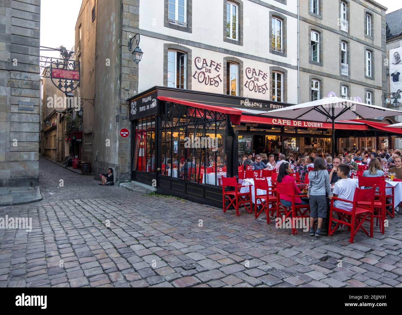 Saint-Malo, France - August 25, 2019: Locals and tourists at the Cafe de l'Ouest at Place Chateaubriand within the walled old town of Saint-Malo in Br Stock Photo