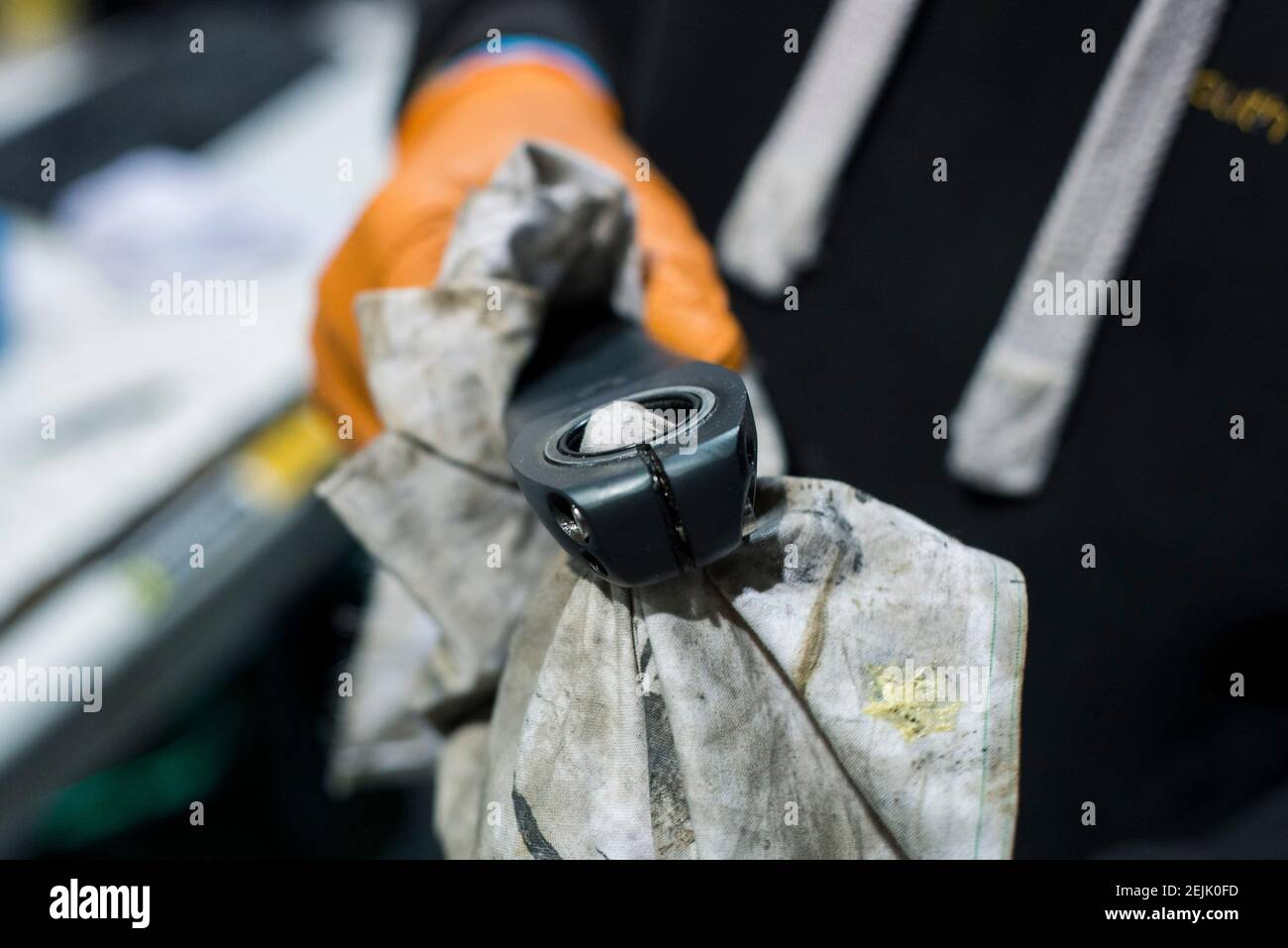 close up detail shots of a bike mechanic servicing parts on a bike. Stock Photo