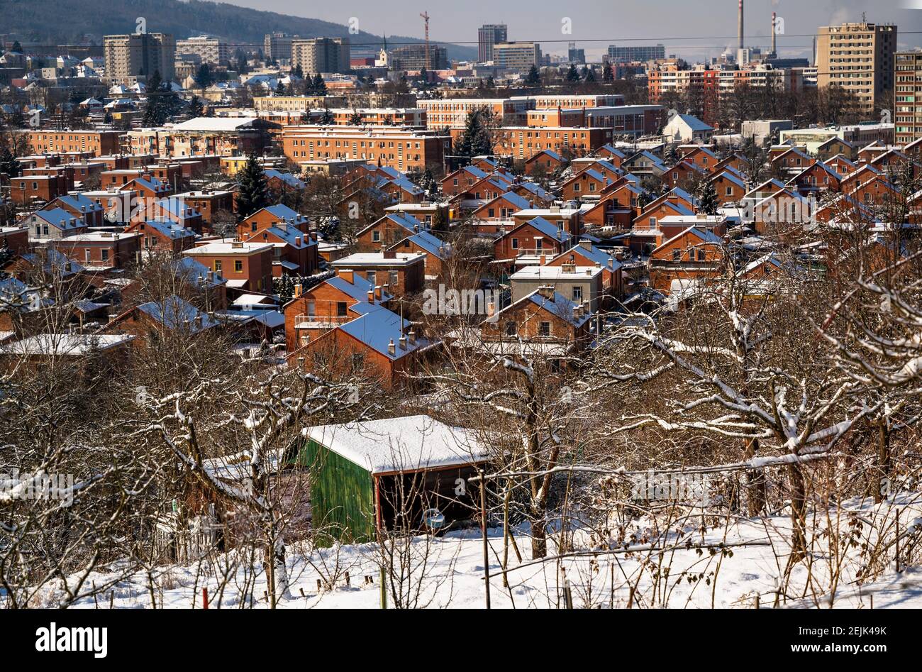 Residential area of typical standardized red brick houses in city Zlin, in winter snowy day. Stock Photo