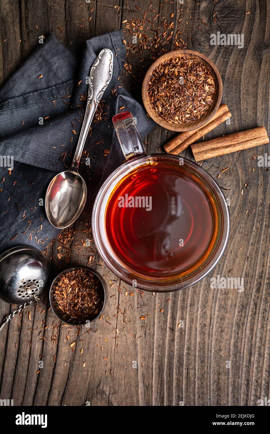 Freshly made Rooibos tea full of antioxidants on wooden background Stock Photo