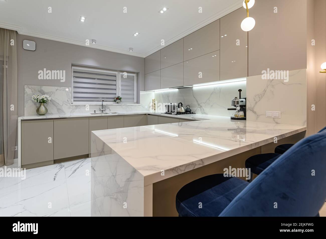 Luxury white modern marble kitchen in studio space Stock Photo Alamy