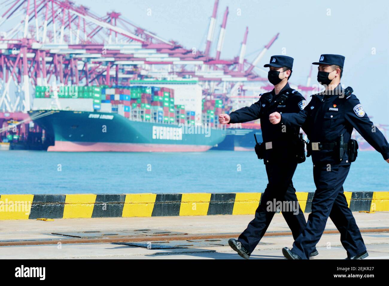 Police Container Terminal Chinese police officers patrol a container terminal at the Port of ...