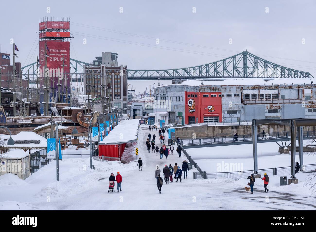 montreal, CA - 22 February 2021: Old Port of Montreal, with Jacques Cartier Bridge in background Stock Photo