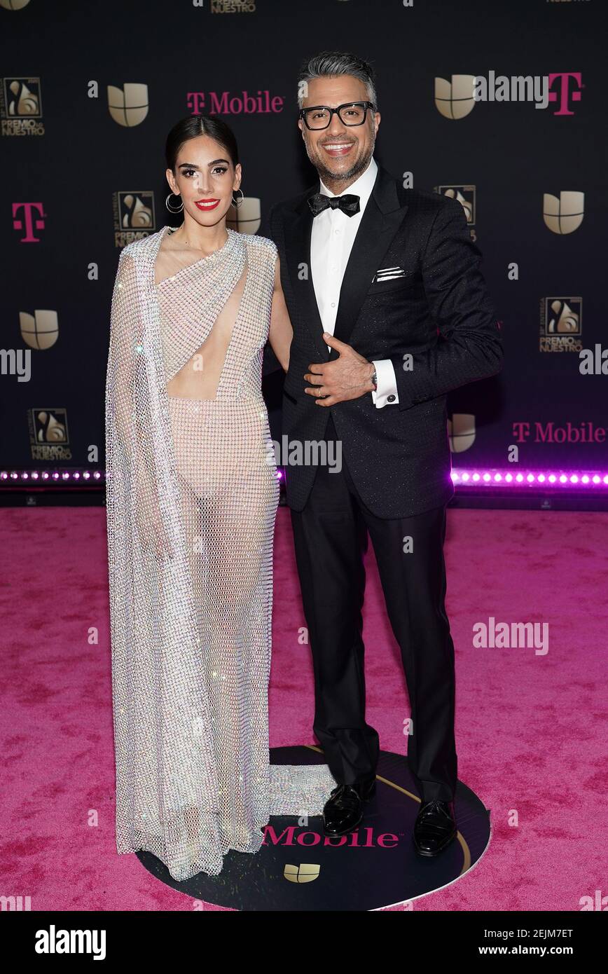 MIAMI, FLORIDA - FEBRUARY 20: Sandra Echevarria and Jaime Camil attend