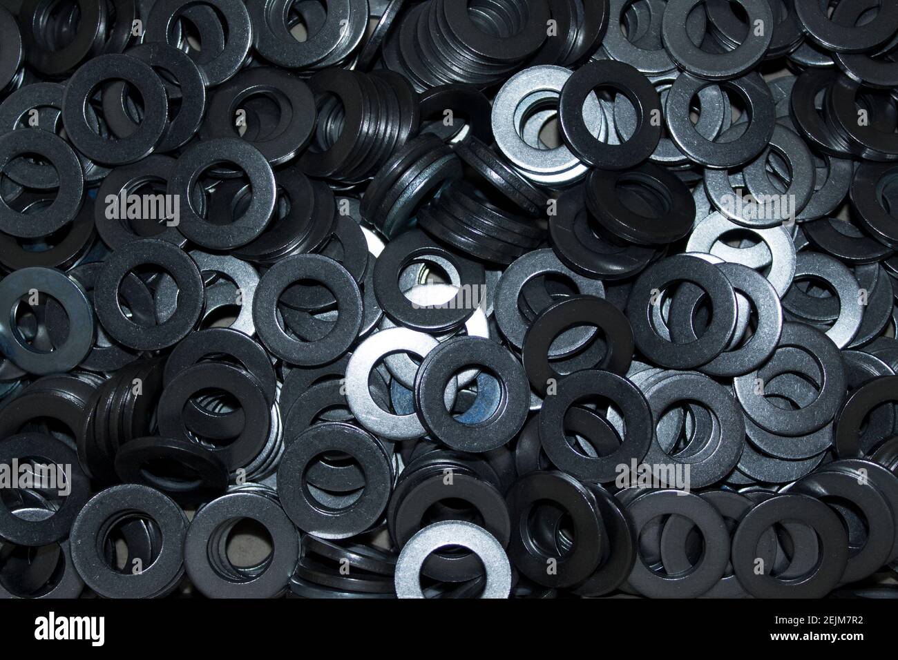 Lots of big industrial steel washers on a pile Stock Photo Alamy