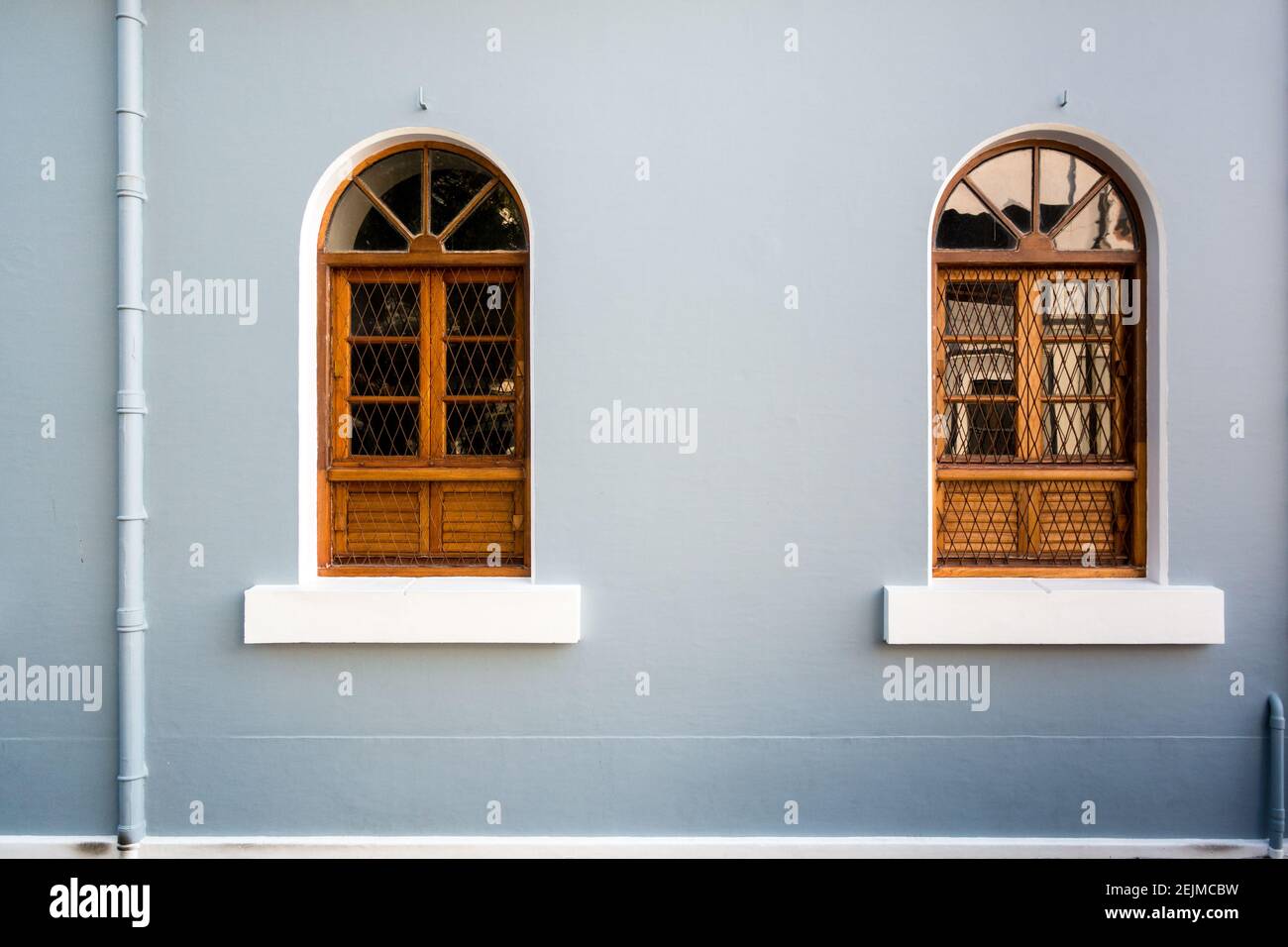 Brightly painted windows in teh French colonial quarter in Pondicherry Stock Photo