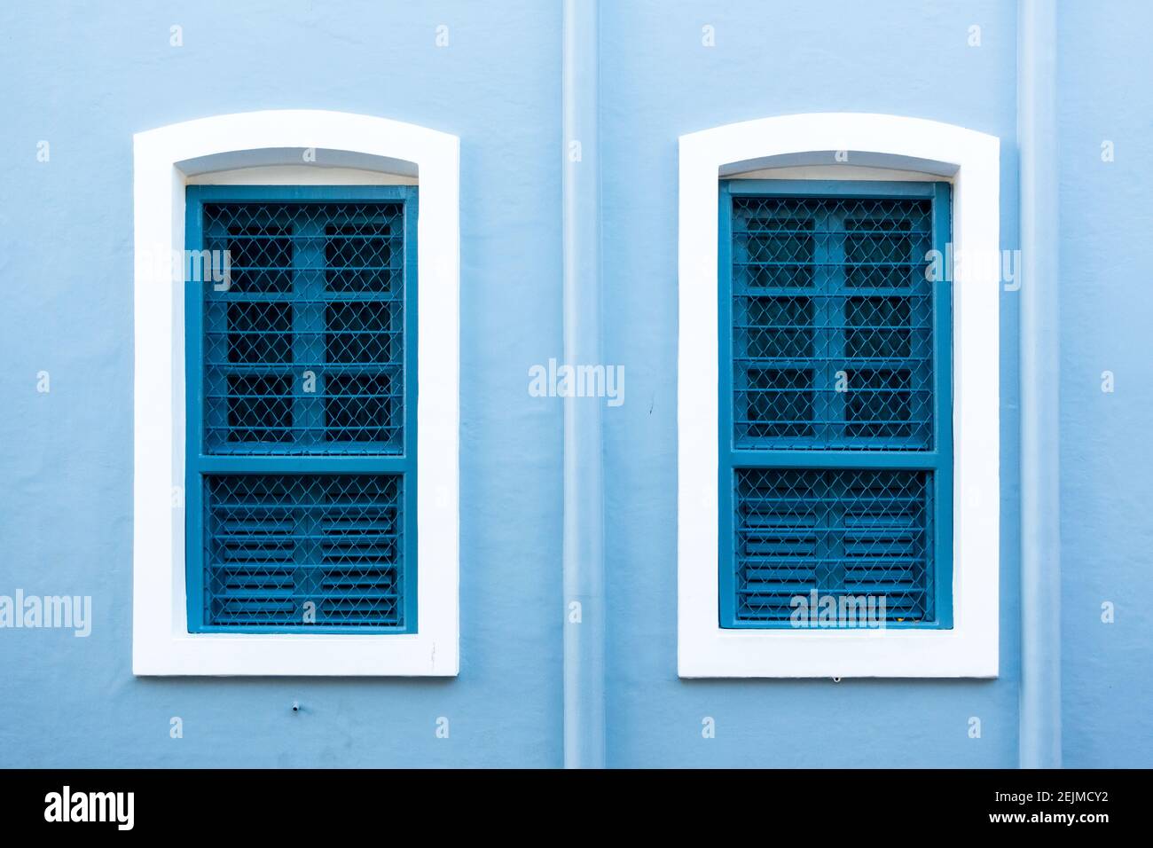 Brightly painted windows in teh French colonial quarter in Pondicherry Stock Photo