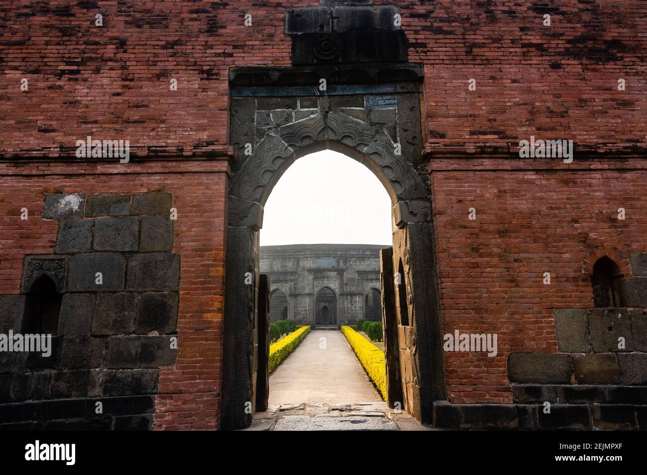 Malda, West Bengal, India - January 2018: The entrance gateway to the ruins of an ancient mosque in the village of Pandua in Malda. Stock Photo