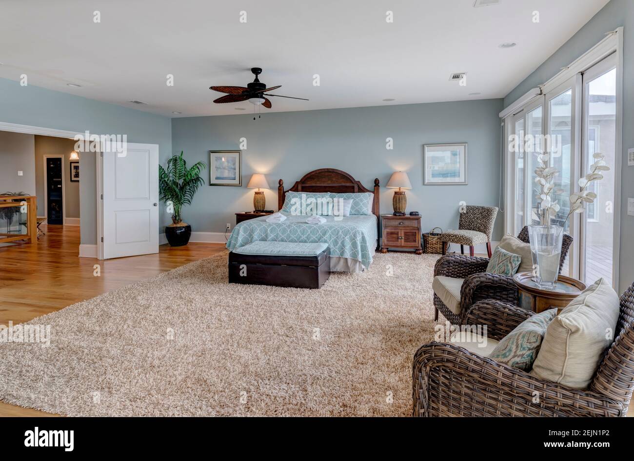 Large luxury bedroom suite with large glass doors, Stock Photo