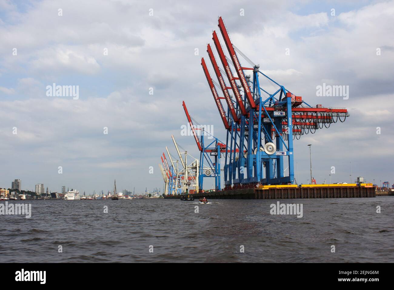 Harbor Cargo Freight Container Shipping Cranes in Hamburg Harbor for global Logistics terminal Burchardkai loading freighters for international shipme Stock Photo