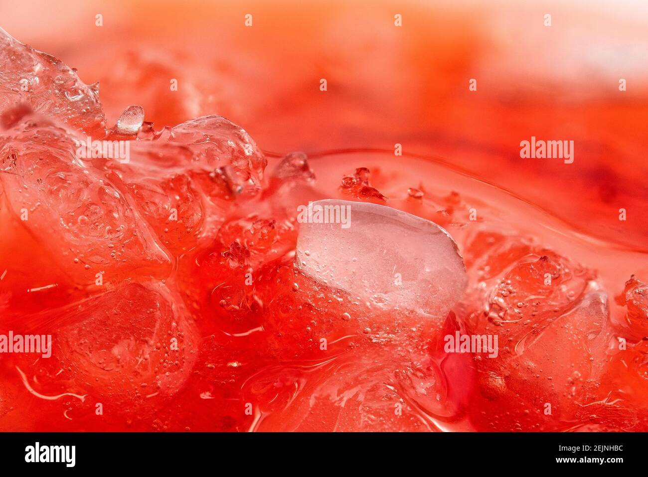 Extreme close-up of frappe ice on a strawberry, daiquiri cocktail. Stock Photo