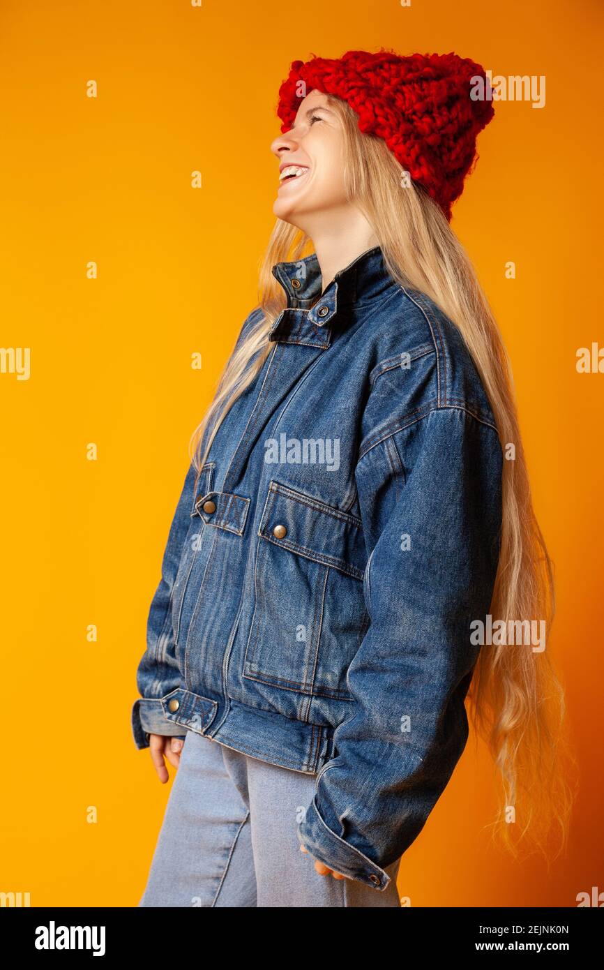 Cheerful woman in orange hat hi-res stock photography and images - Alamy