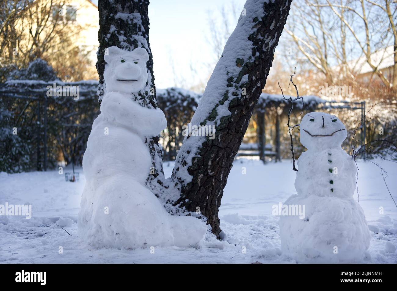 Couple of creepy snowmen in a backyard Stock Photo