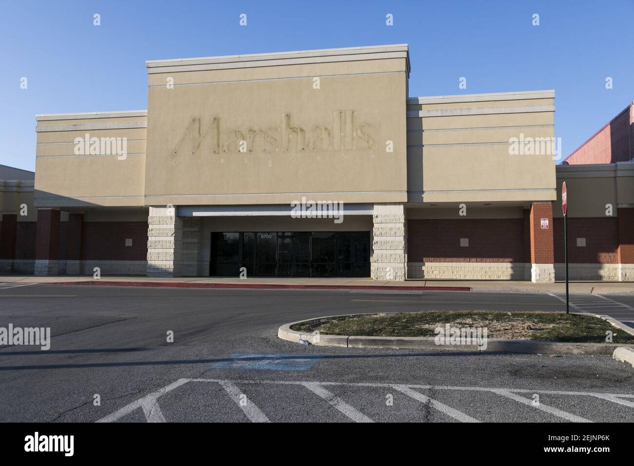 A the faded outline of a Marshalls logo sign outside of a closed retail