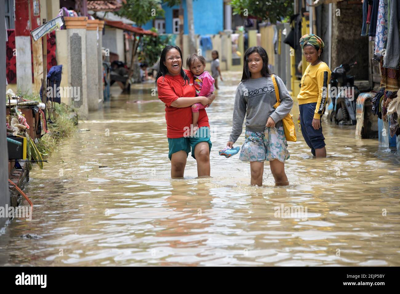 Residents passed the flood in Pamanukan, Subang Regency, West Java, on ...