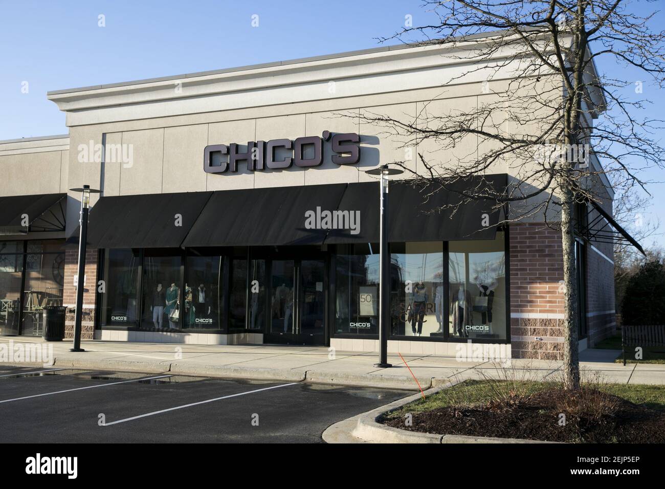 A logo sign outside of a Chico's retail store location in Waldorf
