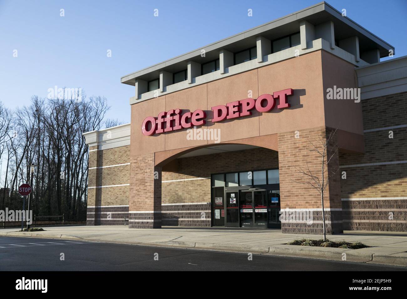 A logo sign outside of a Office Depot retail store location in Waldorf