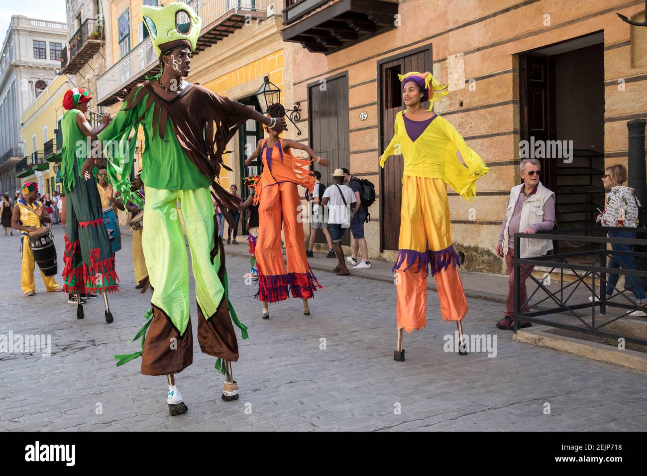Street performers on stilts in colorful costumes in Old Havana, Cuba. Stock Photo