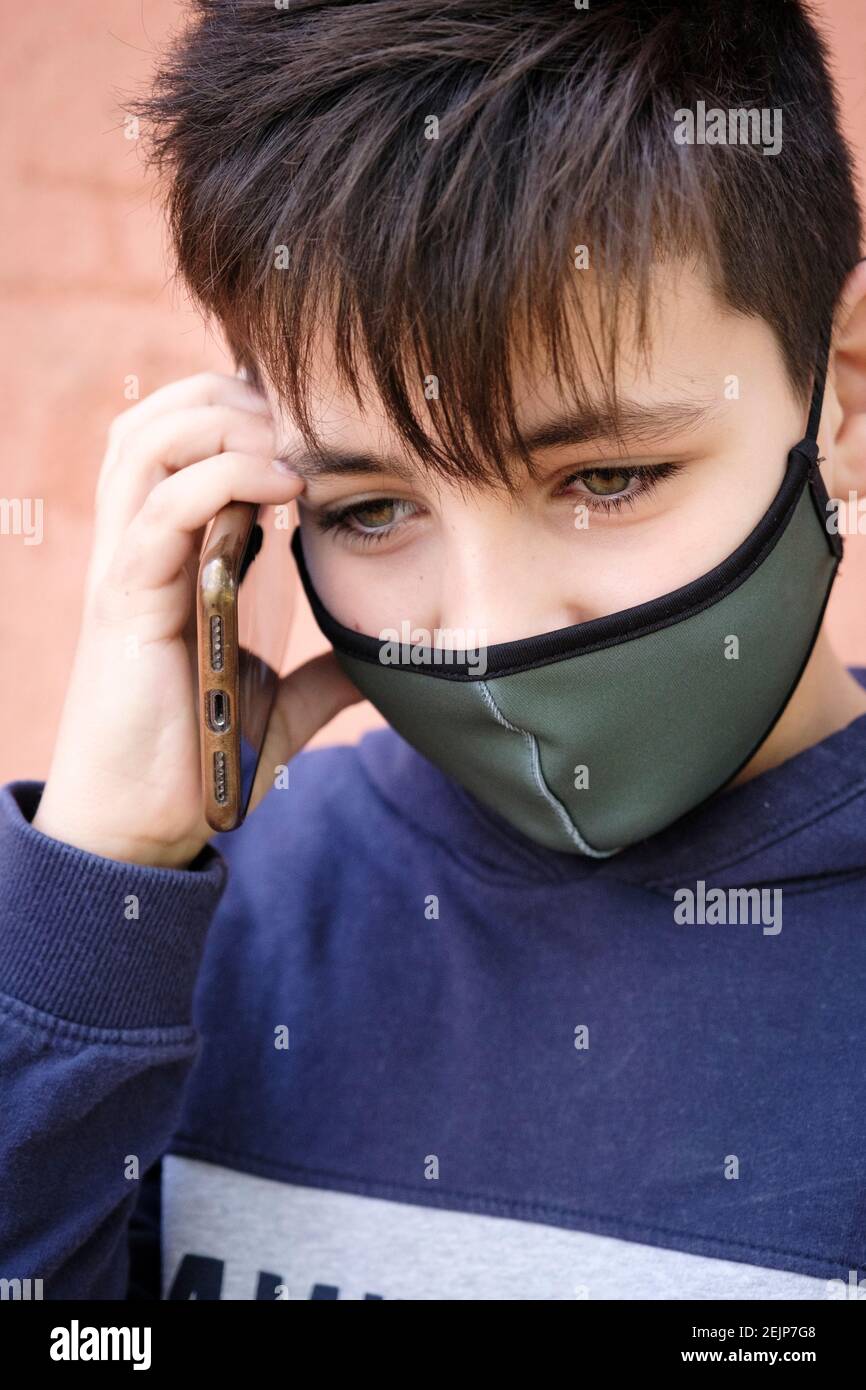 Green Eyes Boy Making A Phone Call Wearing A Green Facemask Stock Photo Alamy Green Eyes Boy Making A Phone Call Wearing A Green Facemask Stock Photo Alamy