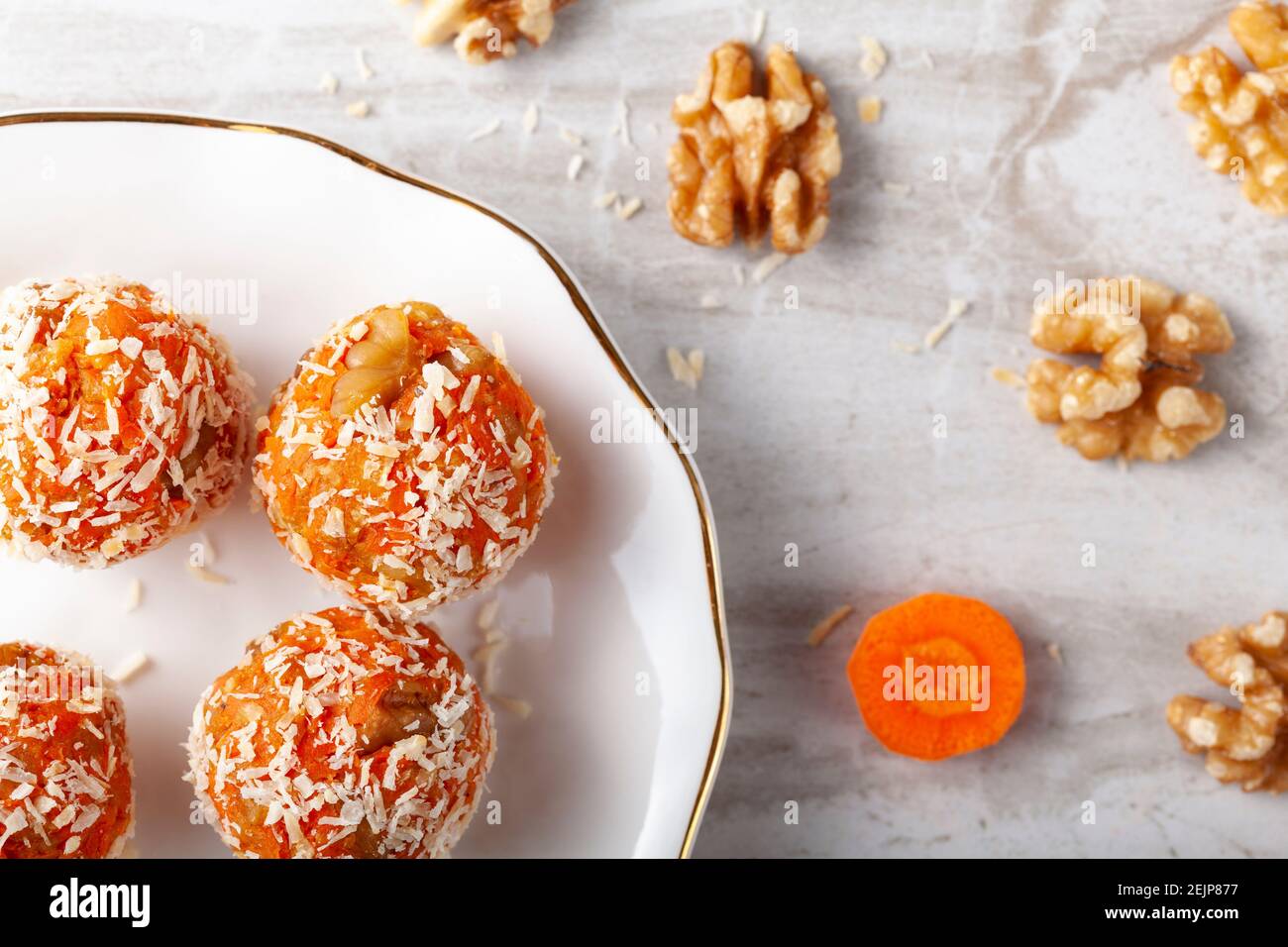 A flat lay of kitchen countertop with a flat porcelain plate. Homemade