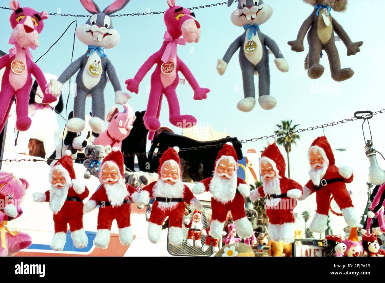 Stuffed Santa and cartoon character toys on sale in a gas station in Hollywood, CA circa 1970s Stock Photo