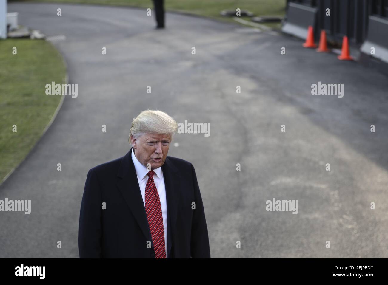 President Donald Trump speaks to the media prior to his departure from the South Lawn of the White House in Washington, DC, on February 28, 2020. - Trump is traveling to North Charleston, South Carolina for a MAGA rally. (Photo by Oliver Contreras/SIPA USA)  Stock Photo