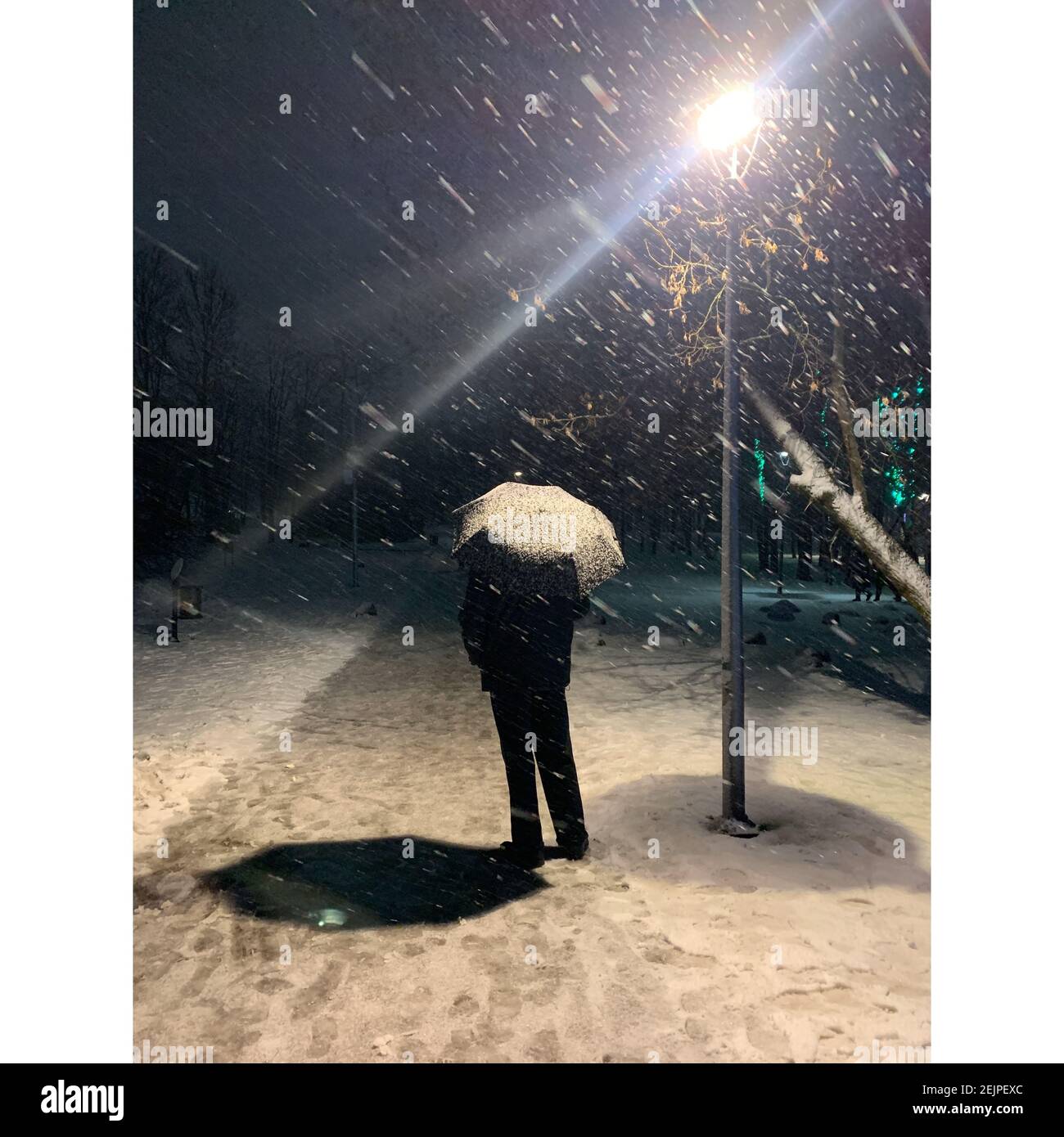 The man under the umbrella Stock Photo