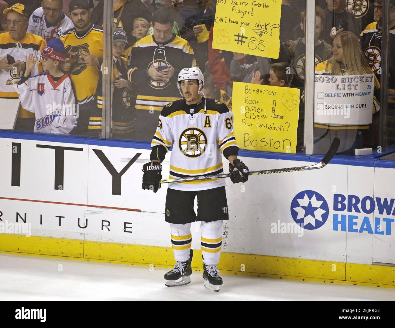 Boston Bruins fans showing their support as Bruins left wing Brad Marchand (63) looks on during warmups before a game against the Florida Panthers at the BB&T Center in Sunrise, Fla., on Thursday, March 5, 2020. (David Santiago/Miami Herald/TNS) Stock Photo