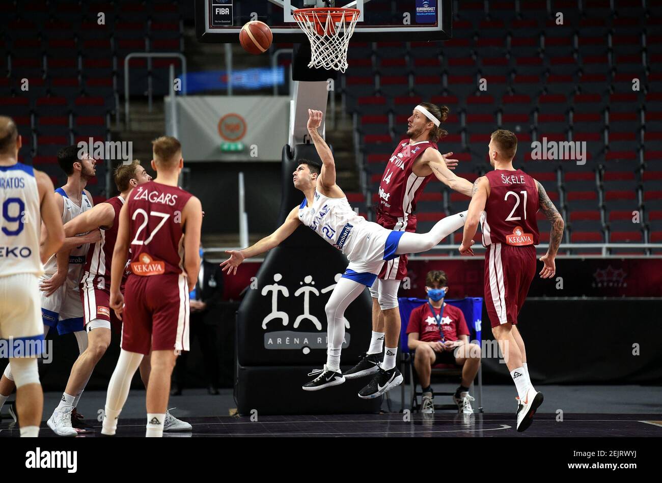 Riga, Latvia. 22nd Feb, 2021. Players compete during the FIBA EuroBasket 2022 qualifying basketball match between Latvia and Greece in Riga, Latvia, Feb