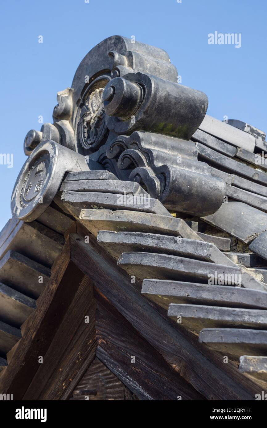 Traditional Japanese grey ceramic roofing tiles or kawara, on a roof at