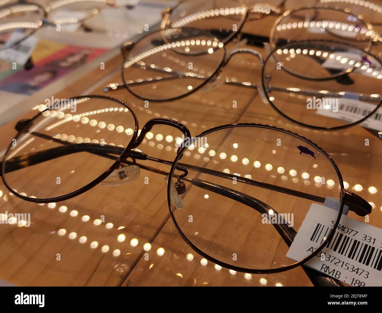 Pairs of antiblue glasses are sold at an eyeglass shop in a shopping