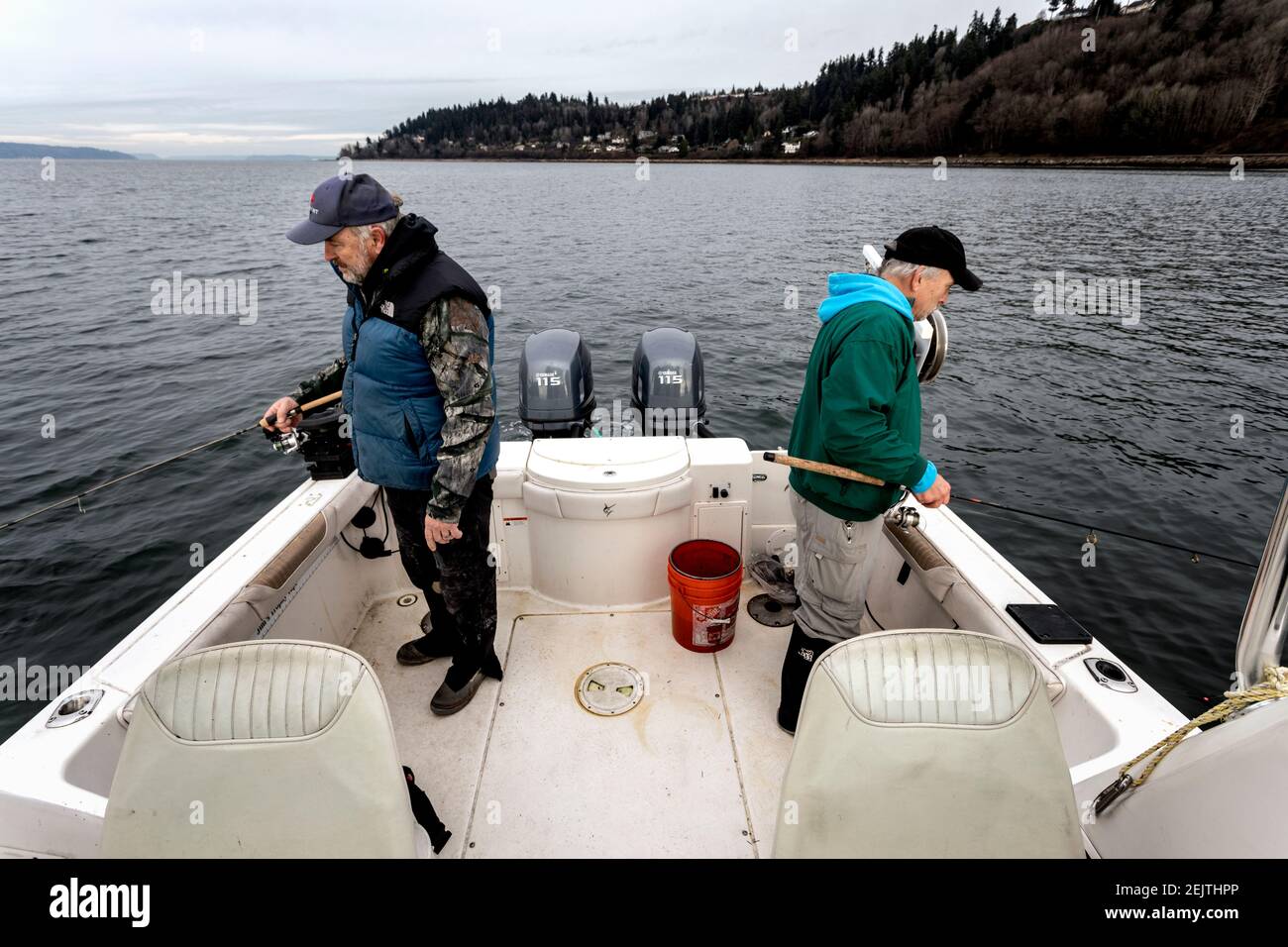 WA20083-00......WASHINGTON - Jim Johanson and Phil Russell jigging for squid on the Puget sound. Stock Photo