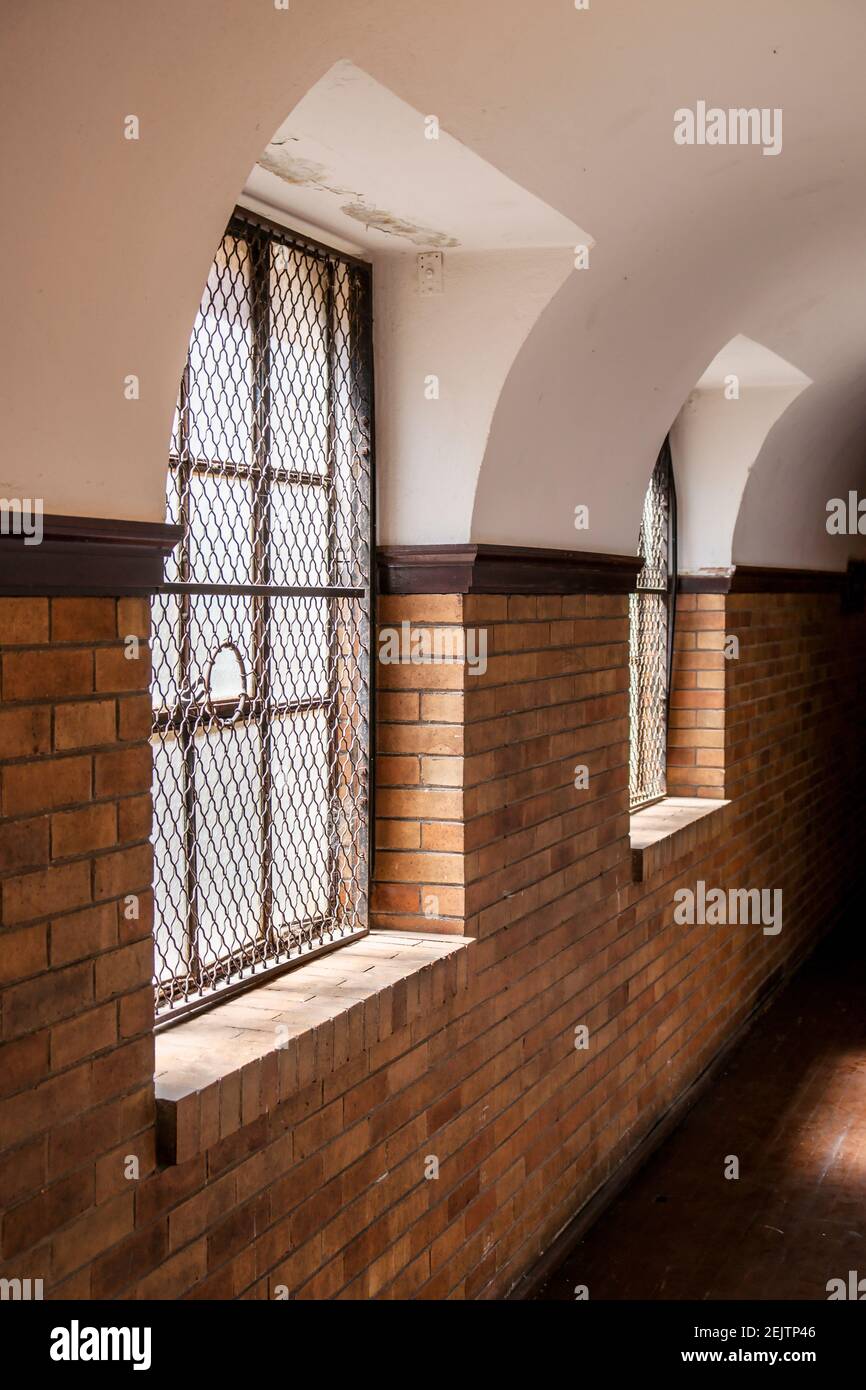 Windows light a brick corridor of the historic Berry United Methodist