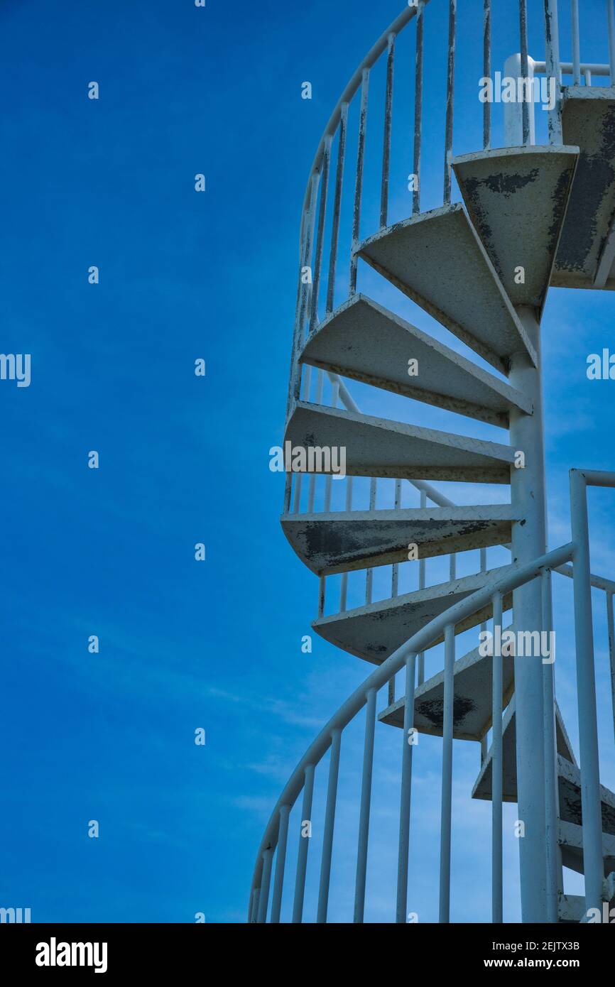 The spiral staircase shown against the early evening sky at the former ... - Oceanfront High-Rise Condos With Spiral Staircase