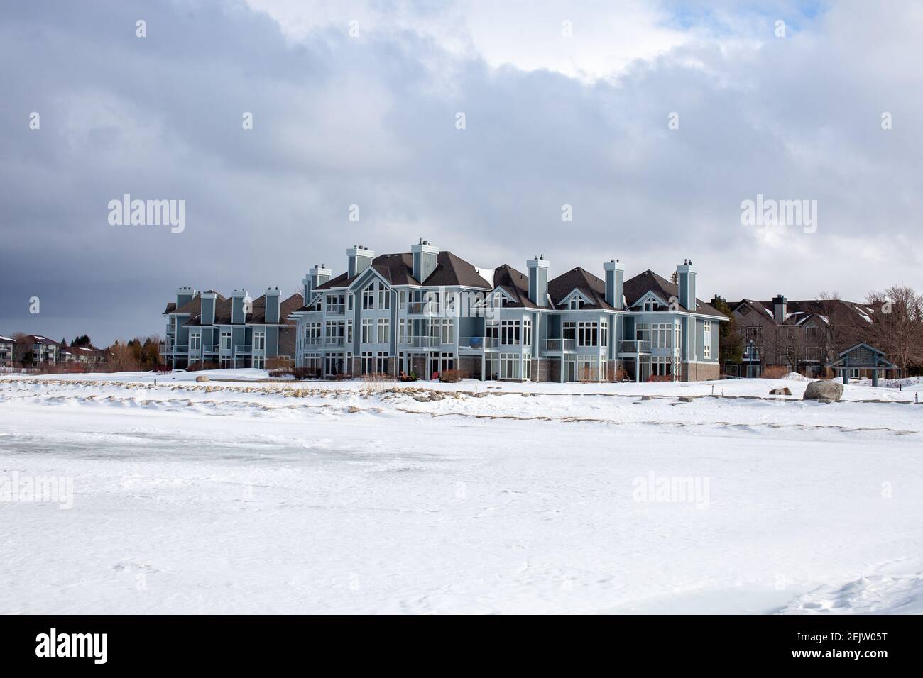 Collingwood's Lighthouse Point is a waterfront condo on Georgian Bay, overlooking the water as well as Blue Mountain. It features walking trails and m Stock Photo