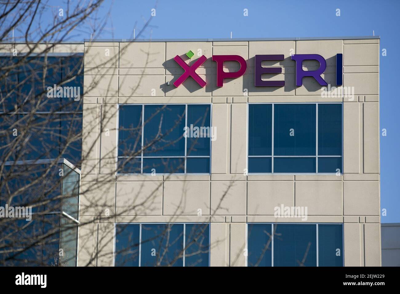 A logo sign outside of a facility occupied by Xperi Corporation in