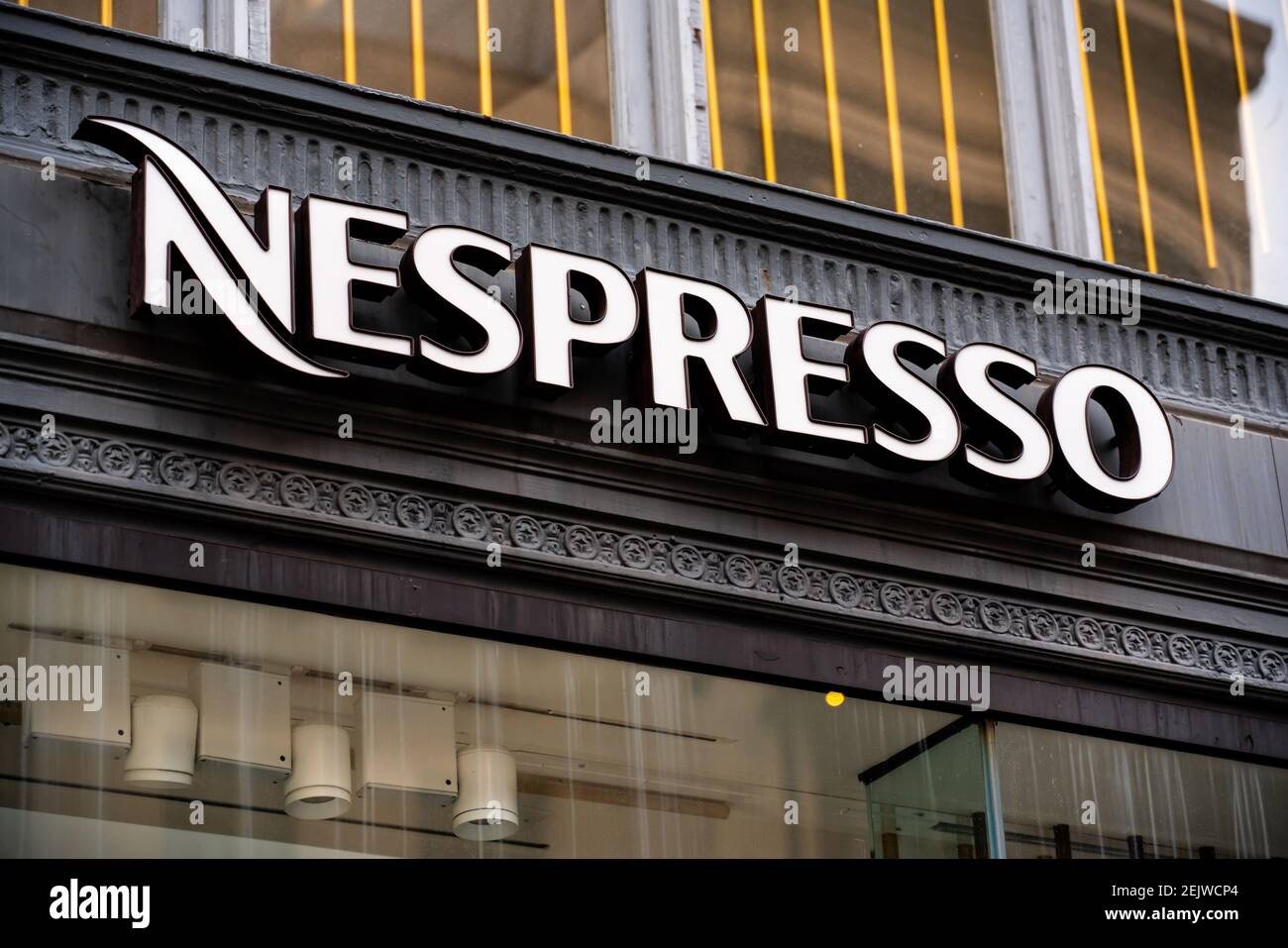 A Swiss coffee capsules brand and a unit of the Nestle Group, Nespresso  logo seen at one of their stores. (Photo by Alex Tai / SOPA Images/Sipa USA  Stock Photo - Alamy