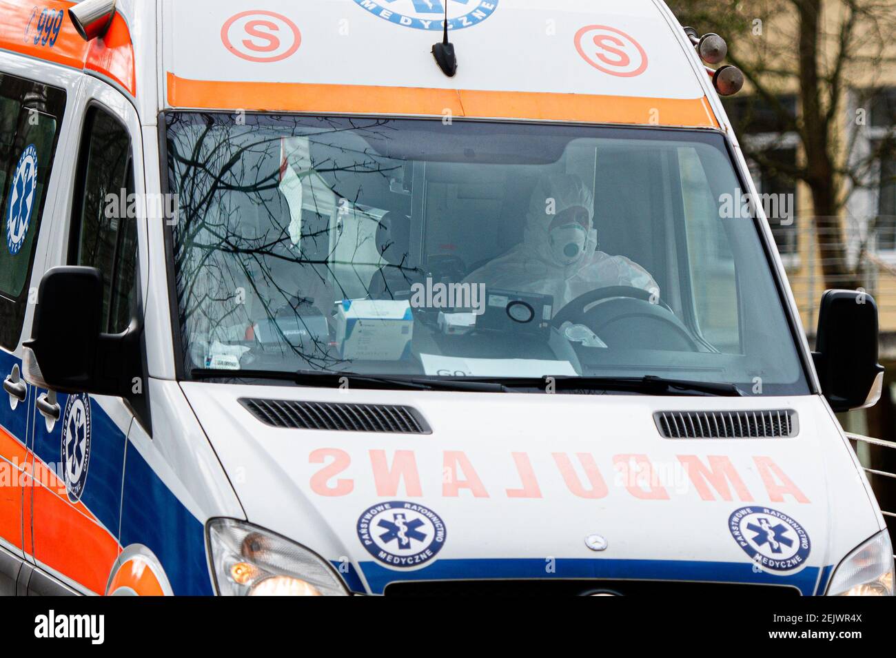 Paramedics Seen In An Ambulance Wearing A Special Safety Uniforms And ...