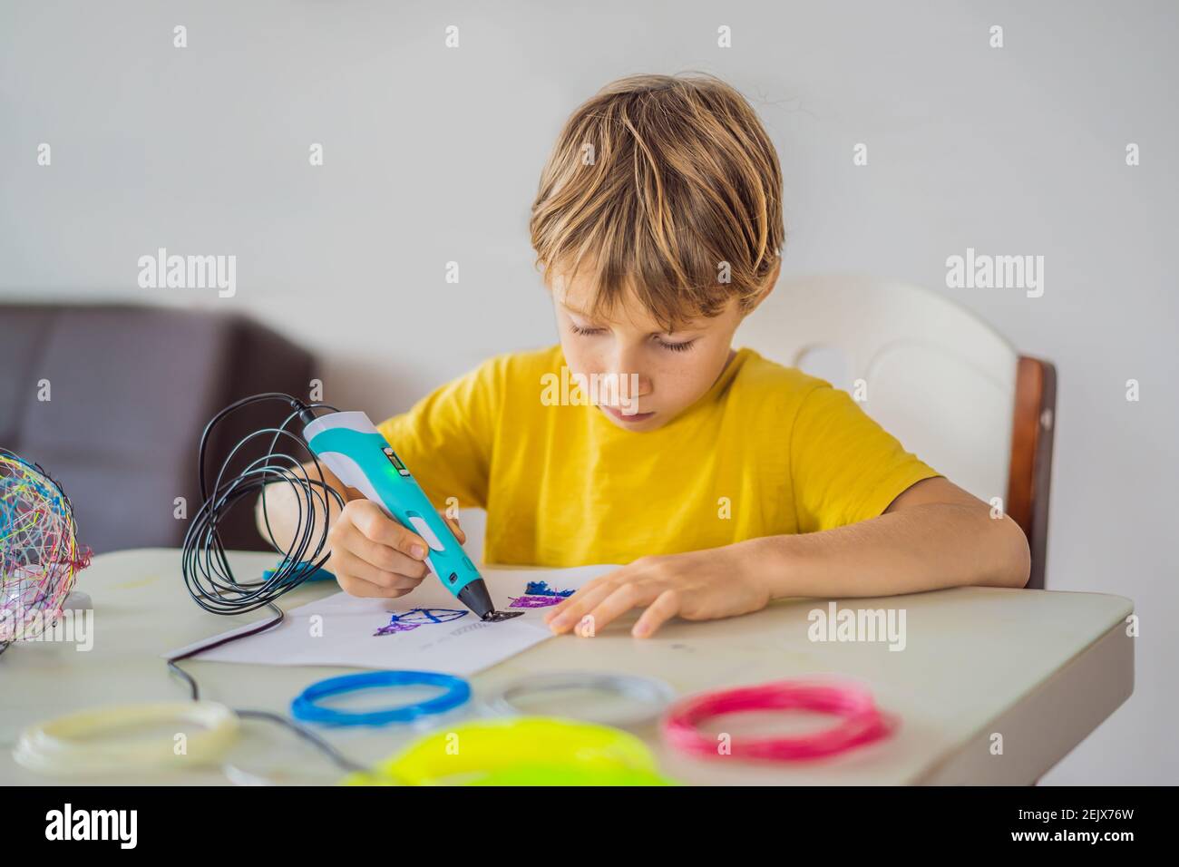 Kid using 3d printing drawing pen. Creative, leisure, technology education concept Stock Photo
