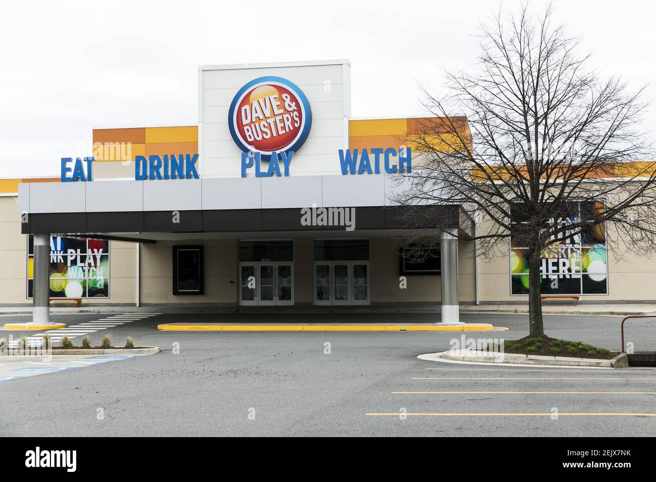 A logo sign outside of a Dave & Buster's location in Fairfax, Virginia