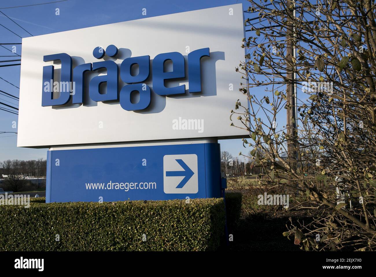 A logo sign outside of a facility occupied by Drägerwerk AG (Dräger) in