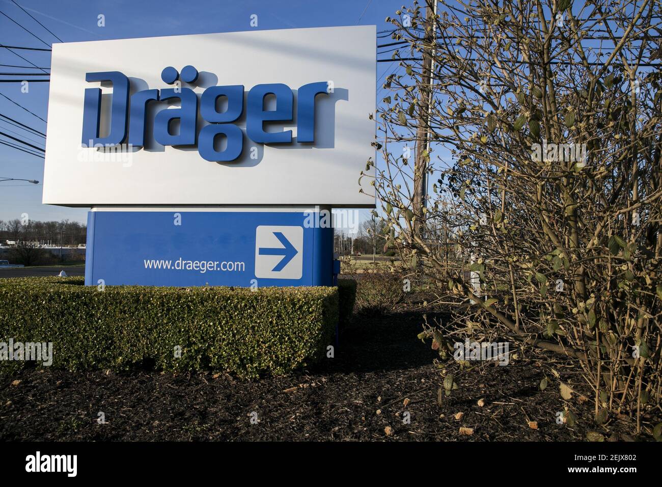 A logo sign outside of a facility occupied by Drägerwerk AG (Dräger) in