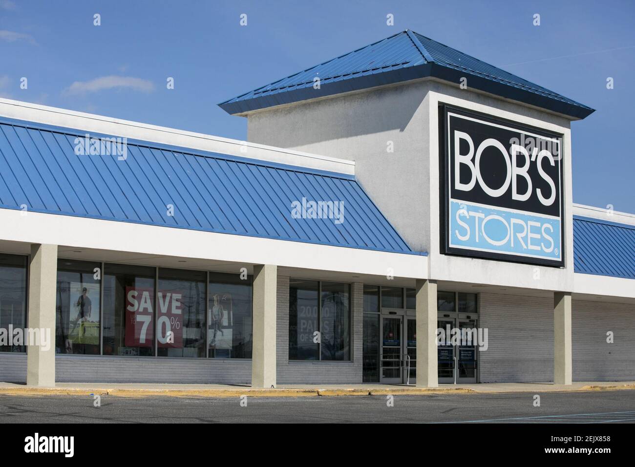 A logo sign outside of a Bob's Stores retail store location in Totowa