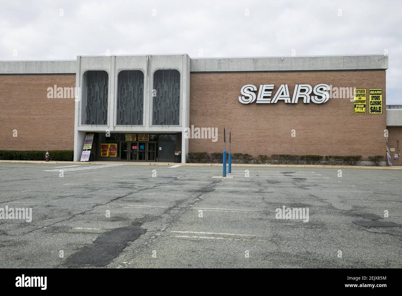 'Store Closing' signs outside of a Sears retail store location in