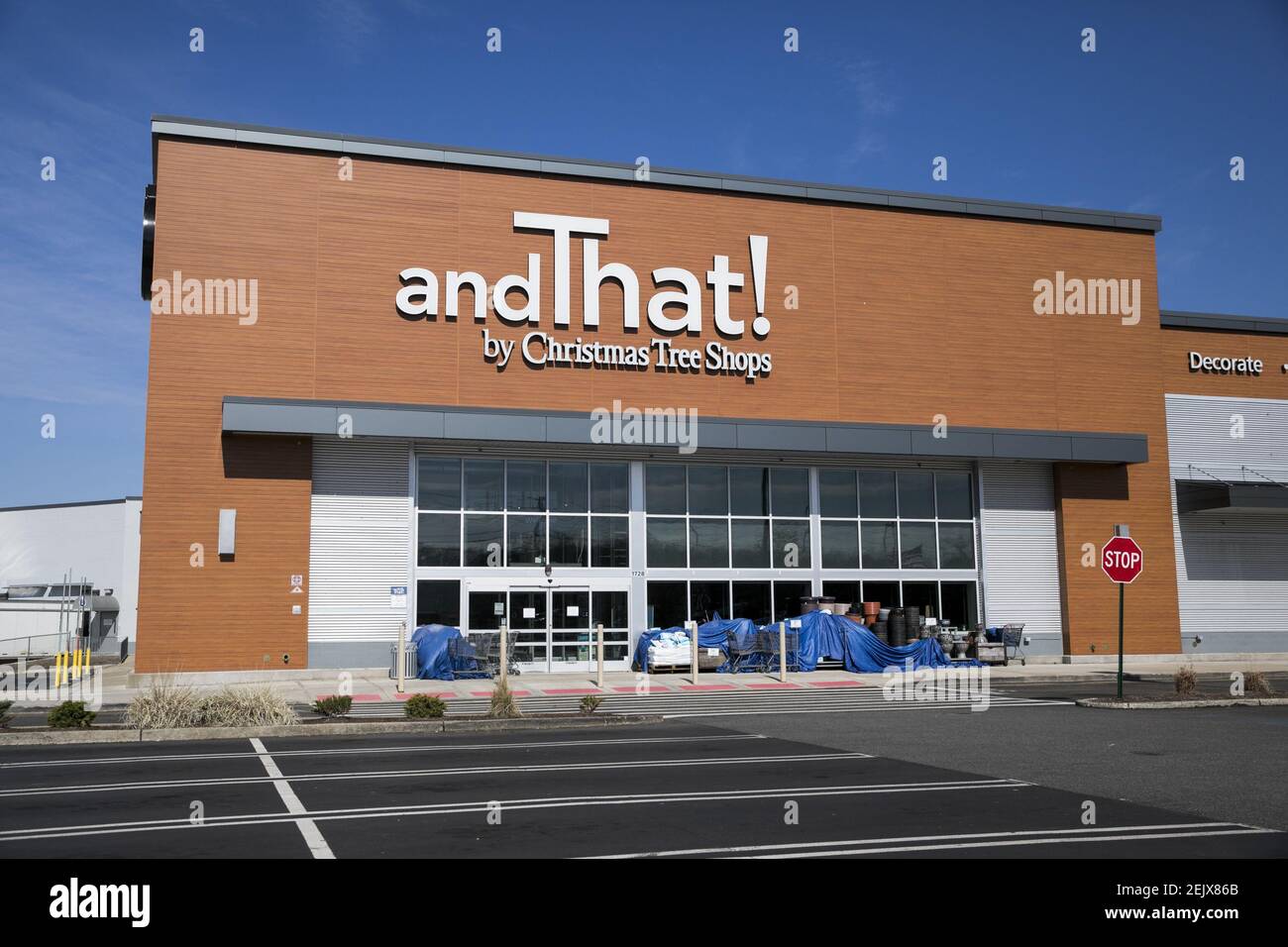 A logo sign outside of a andThat! by Christmas Tree Shops retail store